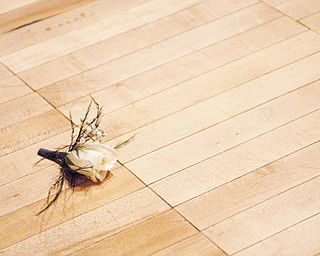 As the crowd cleared, a lost forget-me-not remained on the music hall floor.