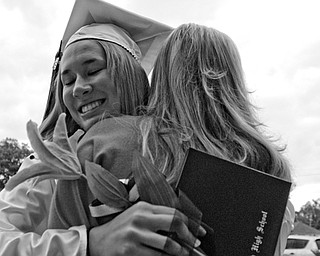 Kim Bertmeyer embraces her sister after the ceremony.