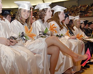Natalie Alberini didn't want to wear out her shoes before walking across the stage.