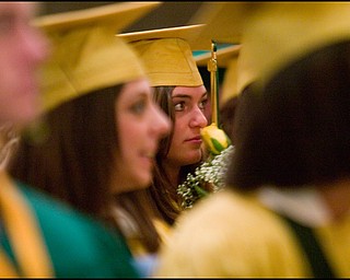 5.31.2008
Hannah Snyder smells a yellow rose during Ursuline High School's commencement ceremony at Stambaugh Auditorium Saturday morning.