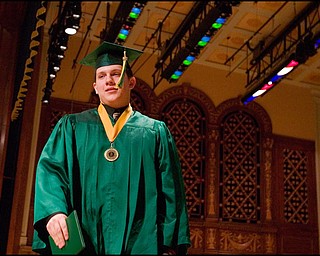 5.31.2008
Michael Paul Jenkins crosses the stage after receiving his diploma at Ursuline's Commencement Ceremony at Stambaugh Auditorium Saturday morning.
