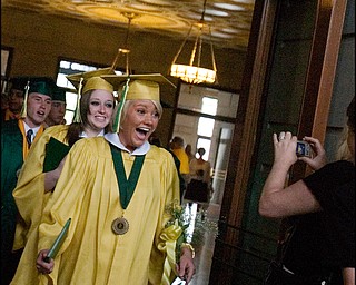 5.31.2008
Hannah Banks reacts to her photo being taken following Ursuline High School's commencement ceremony at Stambaugh Auditorium Saturday morning.