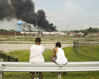 Youngstown residents Sheldon Johnson, 11, and Leon Bell, 9, watch the fire from over a mile away.