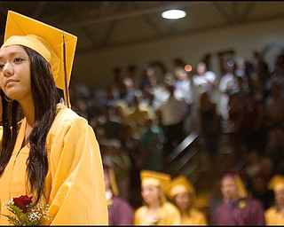 6.7.2008
Lokelani Elizabeth Mae Kalima waits to sit down as the fellow members of her South Range High School graduating class enter the gymnasium at South Range High School Saturday evening.