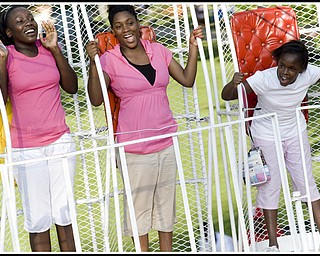 Close-up: L-R, JeLayla Williams, 15, Kehmonni Scott, 14, and Sarah Smith, 10.
