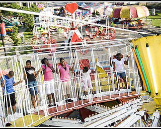 Wide Angle: L-R, Starting with black shirt, Janetta Torres, 16,  JeLayla Williams, 15, Kehmonni Scott, 14, and Sarah Smith, 10. Torres was arguing with the boy at far right while we spun at 50 mph. 