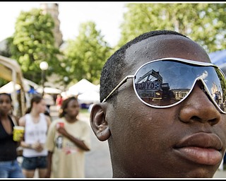 Markell Russell, 13, of Warren in his his new shades, checking out the Gyro stand.