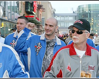 Kelly Pavlik flanked by corner man Mike Cox, left, and Team Pavlik member John Daltorio waling down to the boardwalk towards his fight with Gary Lockett