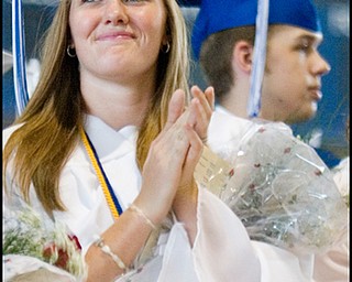 6.8.2008
Sarah Rhein stands, with her fellow graduates during Poland Seminary High School's Commencement Ceremony, applauding the efforts of her friends, family, and community at Poland Seminary High School Field House Sunday afternoon.