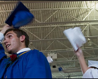 6.8.2008
Andrew Cramp and Dana Doctor throw their hats into the air following Poland Seminary High School's Class of 2008 commencement ceremony Sunday afternoon at the school's field house.