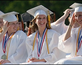 6.8.2008
(from left to right)
Alexandria Hickman, Ashley Huffman and Melissa Huffman share in a laugh during Springfield High School's Class of 2008 commencement ceremony Sunday evening at the school's stadium.