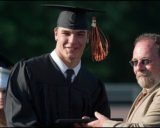 6.8.2008
Jarrod Lewis accepts his diploma from Len Fagnano, Vice President of the Board of Education, during Springfield High School's Class of 2008 commencement ceremony held Sunday evening at the school's stadium.