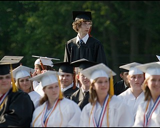 6.8.2008
Matthew Ohlin stands to receive his diploma during Springfield High School's Class of 2008 commencement ceremony held Sunday evening at the school's stadium.