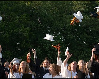 6.8.2008
Graduates of Springfield High School throw their hats into the air following the Class of 2008's commencement ceremony held Sunday evening at Springfield High School's Stadium.