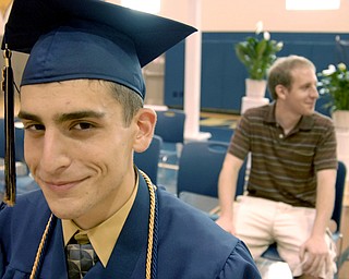 Front, Zachary Matisi, 17, was the second person in his family to be named valedictorian of his class. The first was his brother, John, rear, who graduated from Lowellville High School in 2006.