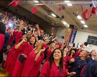 6.15.2008
HATS OFF TO THE CLASS OF 2008
Alexis Allen smiles as she and her fellow classmates throw their caps into the air following Austintown Fitch High School's Commencement Ceremony held Sunday afternoon in the school's gymnasium.