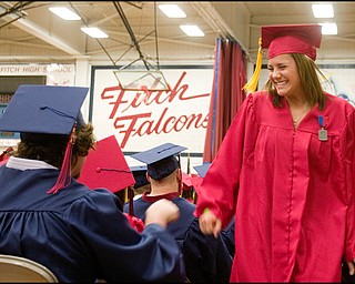 6.15.2008
Kelly Repasky pounds fists with a friend on the way back to her seat after receiving her diploma during Austintown Fitch High School's Annual Commencement Ceremony in the school's gymnasium, Sunday afternoon.