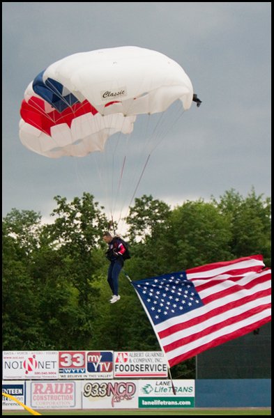 6.17.2008
Jimmy Drummond, resident and firefighter of Youngstown floats to the field to start off the Mahoning Valley Scrappers' season opener at East Wood Field, Tuesday evening. Drummond has been sky diving since 1993 and holds the title of National Accuracy Champion.
