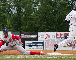 6.17.2008
Scrappers batter Isaias Velasquez beats the throw as Crosscutter infielder Jeremy Hamiton leaves the bag during Tuesday's season opener at Eastwood Field.