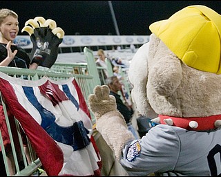 6.17.2008
Mitchell Mort (7), of Marshfield Wisconsin, waves to Scrappy the mascot during a game between the Mahoning Valley Scrappers and the Williamsport Crosscutters Tuesday night at Eastwood Field. Mort and his family are visiting relatives in Howland where his father grew up.