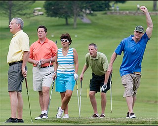 6.24.2008
John Finizio(left), of Poland, is taken aback after realizing his putt on the second green is short, while his fellow golfers, David Coy, of Boardman, Nikki Manuel, of Boardman, Matt Taylor, of Youngstown, and Brian Jennings, long-snapper of the San Francisco 49ers react as they try to predict the ball's final resting place during of the the DeBartolo Golf outing at the Youngstown Country Club, Tuesday morning.