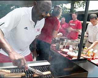 6.24.2008
Jerome Jones, of Youngstown cooks sausages for guests at the DeBartolo Golf outing at the Youngstown Country Club, Tuesday morning.