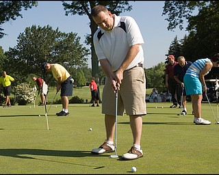6.24.2008
Mike Kapics, of Youngstown, practices his putting before taking to the course for the DeBartolo Golf outing at the Youngstown Country Club, Tuesday morning. This is Kapics second year participating in the event that benefits The Edward J. DeBartolo Memorial Scholarship Foundation, which has awarded more than $400,000 in the past ten years.