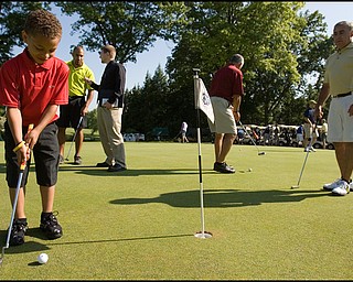 6.24.2008
Joe Nastasi, age 6 of State College Penn., practices his putting before taking to the course with his father who participates in the DeBartolo Golf outing at the Youngstown Country Club, Tuesday morning.