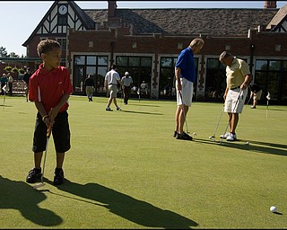 6.24.2008
Joe Nastasi, age 6 of State College Penn., practices his putting before taking to the course with his father who participates in the DeBartolo Golf outing at the Youngstown Country Club, Tuesday morning.