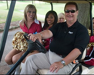 6.24.2008
Tim Gay drives a golf cart with 49ers Gold Rush Ambassadors following their sale of raffle tickets to raise funds for the Edward J. DeBartolo Memorial Scholarship Foundation.