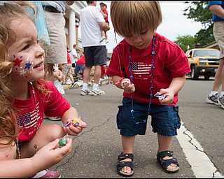 7.4.2008
Taylor (4) and Dylan (2) Smesko, of Canfield, gather candy from the sides of Route 46 in downtown Canfield during the Fourth of July parade held Friday morning.