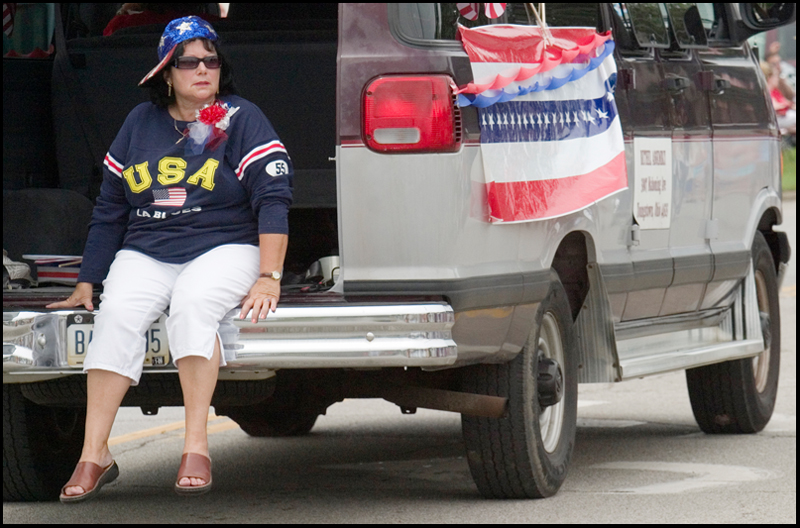 7.4.2008
Janet Pence, of Austintown, rides along on the back of a van decorated by Bethel Assembly of God during Austintown's Fourth of July Parade.
