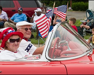 7.4.2008
Beatrice and Martin Joseph, of Austintown, ride past during the Austintown Fourth of July Parade in their 1960 Corvette. Martin restored the vehicle himself.
