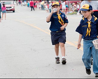 7.4.2008
Robert Malizia (8) and Chase Toole (8) distribute candy and rehydrate while walking the parade route during Austintown's Fourth of July Parade. The two boys are Cub Scouts in Pack 84 based at Austintown Community Church.