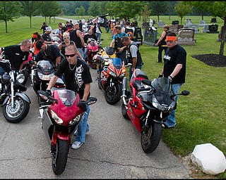 7.6.2008
Matt Rohrbaugh (left) and Joe Mix (right), both of Austintown, stand with a total of more than 47 motorcyclists at Resurrection Cemetery off Raccoon Road in Austintown after paying respects at the grave of Matthew Adam Tynal. The stop was part of a ride organized by Mix, a member of "The Lost Boyz," a motorcycle group created in honor of Tynal, who passed away July 1, 2007 from a motorcycle accident in Youngstown.