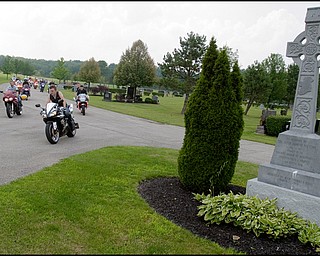 7.6.2008
Jason Pavlik, of Austintown, leaves Resurrection Park in Austintown following paying respects at the grave site of Matthew Adam Tynal along with over 46 other motorcyclists.