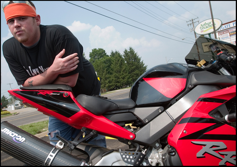 7.6.2008
Joe Mix, of Austintown, leans on his bike in a parking lot along Mahoning Ave. in Austintown preparing to lead a procession of 47 motorcyclists on a ride in honor of Matthew Adam Tynal who passed away from a motorcycle accident July 1, 2007.
