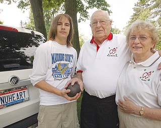 TRANSPLANT GAME PARTICIPANT: Russell D. Beatty Sr., center, who has a new heart, will be in Pittsburgh this weekend to compete in the U.S. Transplant Games, an Olympic-style event for people with organ transplants. With him is his wife Ruth, and his grandson, Travis Beatty, who trains his grandfather in the shot put.