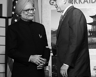 US President George W. Bush, right, with Prime Minister of India Manmohan Singh, left, following their meeting at the G8 summit, Wednesday, July 9, 2008 in the lakeside resort of Toyako on Japan's northen island of Hokkaido.