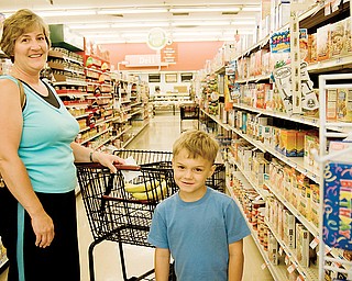 Lori Filicky and her son Mark, 5, of Boardman shopping at the Giant Eagle in Cornersburg. "I'll certainly miss it," She said, "With three boys, I've been here nearly everyday for 17 years."