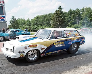 7.5.2008
Bob Bastian, of Warren, pulls up to the starting line at Quaker City Drag Strip in his 1975 Vegas Station Wagon, a Super Pro Class dragster, with a personal best record of an 8.39 second quarter mile at 163 mph.
Bastian fixed and assembled the car, which he has been racing for 10 years, with the help of Abruzzi Transmissions, of Warren, and Koffel's Place who does the engine work.
Bastian has racing since 1964 primarily dragsters since 1964 with a brief stint of stock car racing.
Bastian and his daughter describe the community at the Quaker City Drag Strip as "one big family" where "the kids have grown up together on the weekends" and people gather not only on the track but also off the track in one case taking a trip to Six Flags.
"I've thought about giving it up every weekend I lose," says Bastian referring to his interest in drag racing, " but 10 minutes later I'm ready to go again."
"I've lived on adrenaline all my life," says Bastian, who spent 31 years as a firefighter, and considers adrenaline and competition as major appeals of drag racing.
"Me and my daughter are competitive together," says Bastian, " and she'll be a good racer when she gets in a big car."