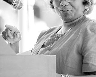[7.12.2008] Fawn Allison, Great Great Granddaughter of master builder P. Ross Berry, speaks to guests during the Commemoration of St. Augustine Episcopal Chapel, of which she is a member, as a recepient of an Ohio Historical Marker July 12, 2008. Charles Berry, son of P. Ross Berry, completed construction of the church in 1921, which is the only known church in Mahoning County to be chartered by an African American woman. The church, chartered by Lenora Berry in 1907, ministered to its congregation out of their homes for 11 years before purchasing the property where the church stands today.