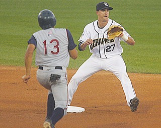 SCRAPPERS - (27) Lonnie Chisenhall waits on the throw as (13) Robi Estrada comes in to break up the play Saturday night at Eastwood Field.
