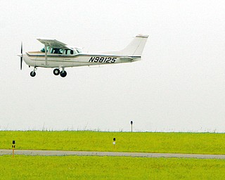 Dan Miller, 17, of Howland, as he prepares for a touch and go as part of his flight class training with Matt Stroney.