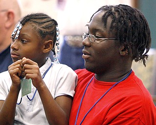 Keith Hayes counselor and DeShante Allen 7, watch intently as Sunshine Gospel.