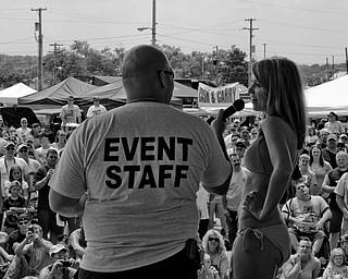 A contestant answers questions during a segment of the bikini contest at the Jeep Festival at the Canfield Fair Grounds on Sunday, July 27, 2008. Daniel C. Britt.
