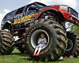 Melody Futchko, 6, of Niles plays on The Nightmare, a monster truck. At home Melody plays on her power wheels jeep. Jeep Fest at the Canfield Fair Grounds, Sunday, July 27, 2008. Daniel C. Britt.
