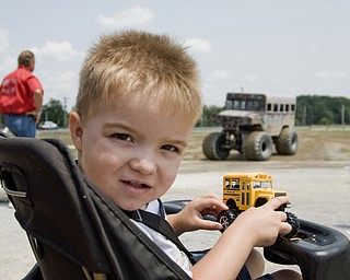 Hunter Dailey, 2, of Lisbon, OH, waits in line for a ride in the monster truck "Sergeant Smash," at the Jeep Festival held at the Canfield Fair Grounds on Sunday, July 27, 2008. Daniel C. Britt.