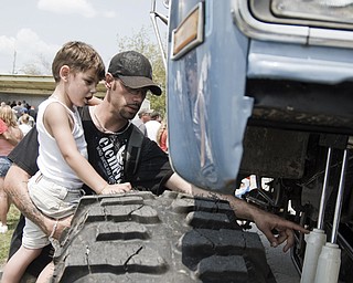 Michael Sopko of Austintown gives his son Ashton, 4, a lesson on shocks at the Jeep Festival at the Canfield Fair Grounds on Sunday, July 27, 2008. Daniel C. Britt.