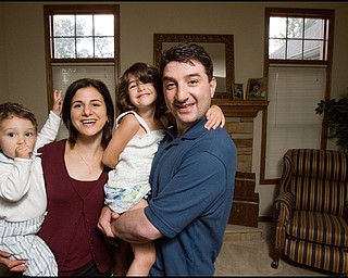 7.24.2008
Dr. Richard Esper, his wife, Dema, 4 year old daughter, Catherine, and 17 month old son, Anthony in their Austintown home.